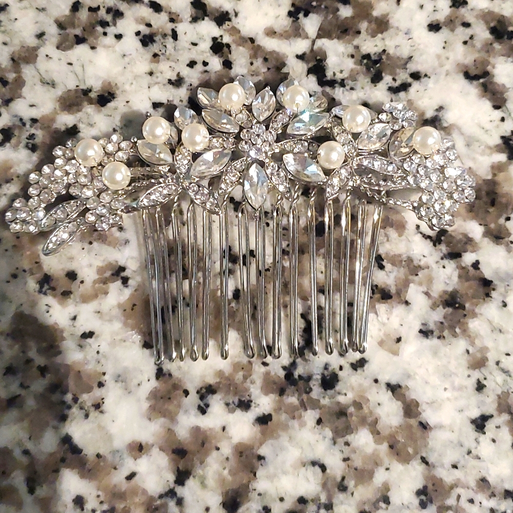 Hair Comb, used once for our wedding and reception. Open to negotiating